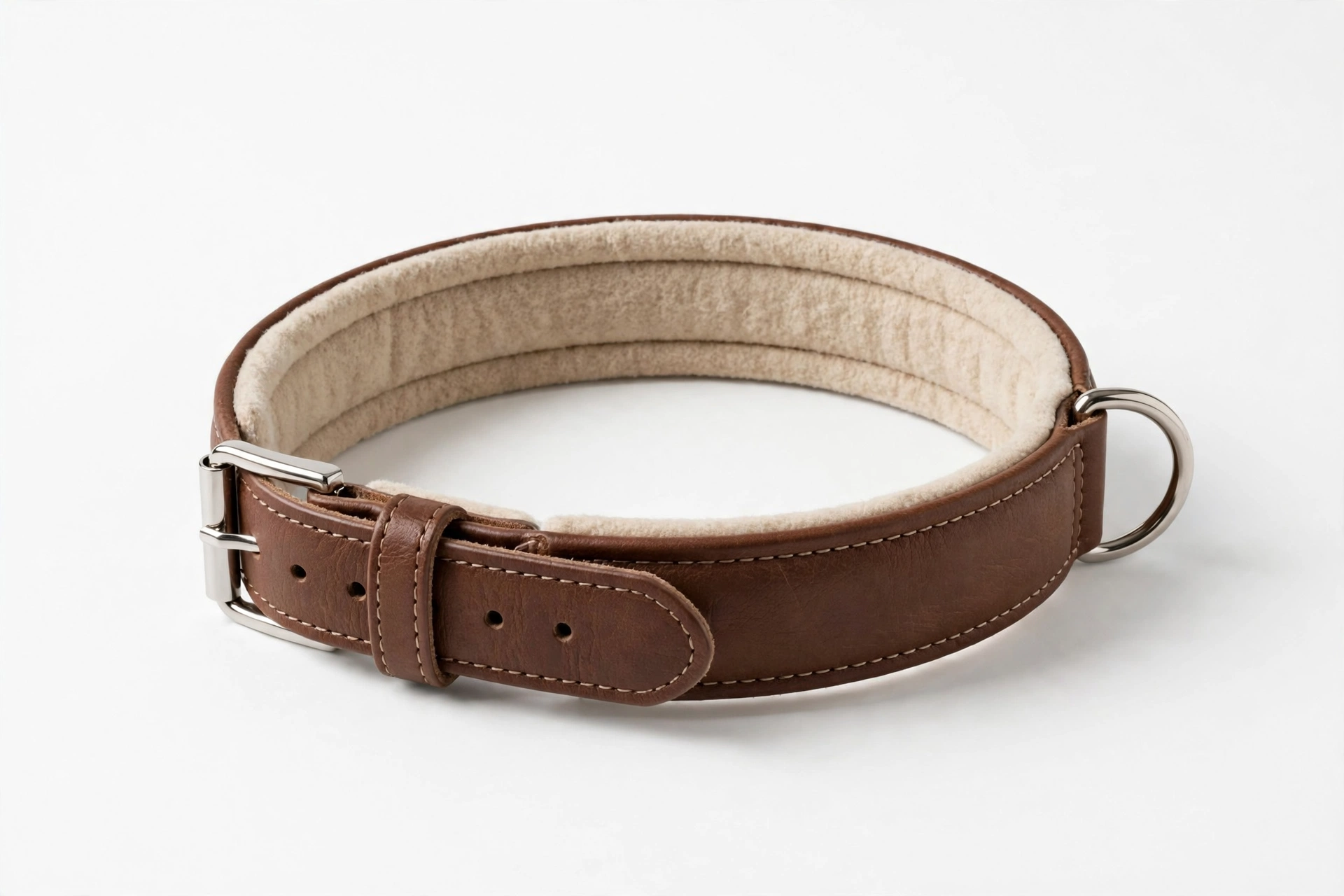 Padded brown leather dog collar with soft lining on white background