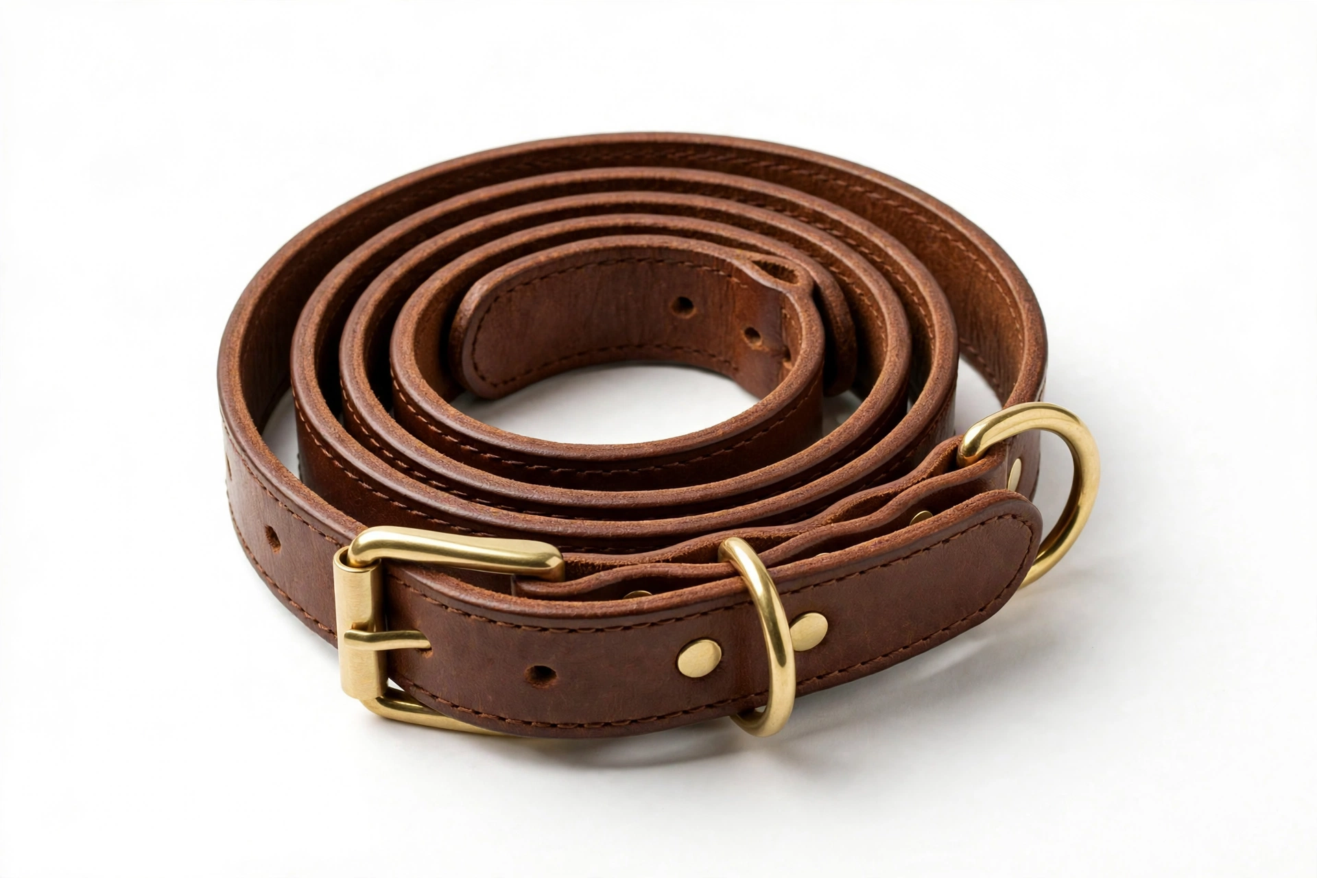 Brown rolled leather dog collar with brass hardware on white background