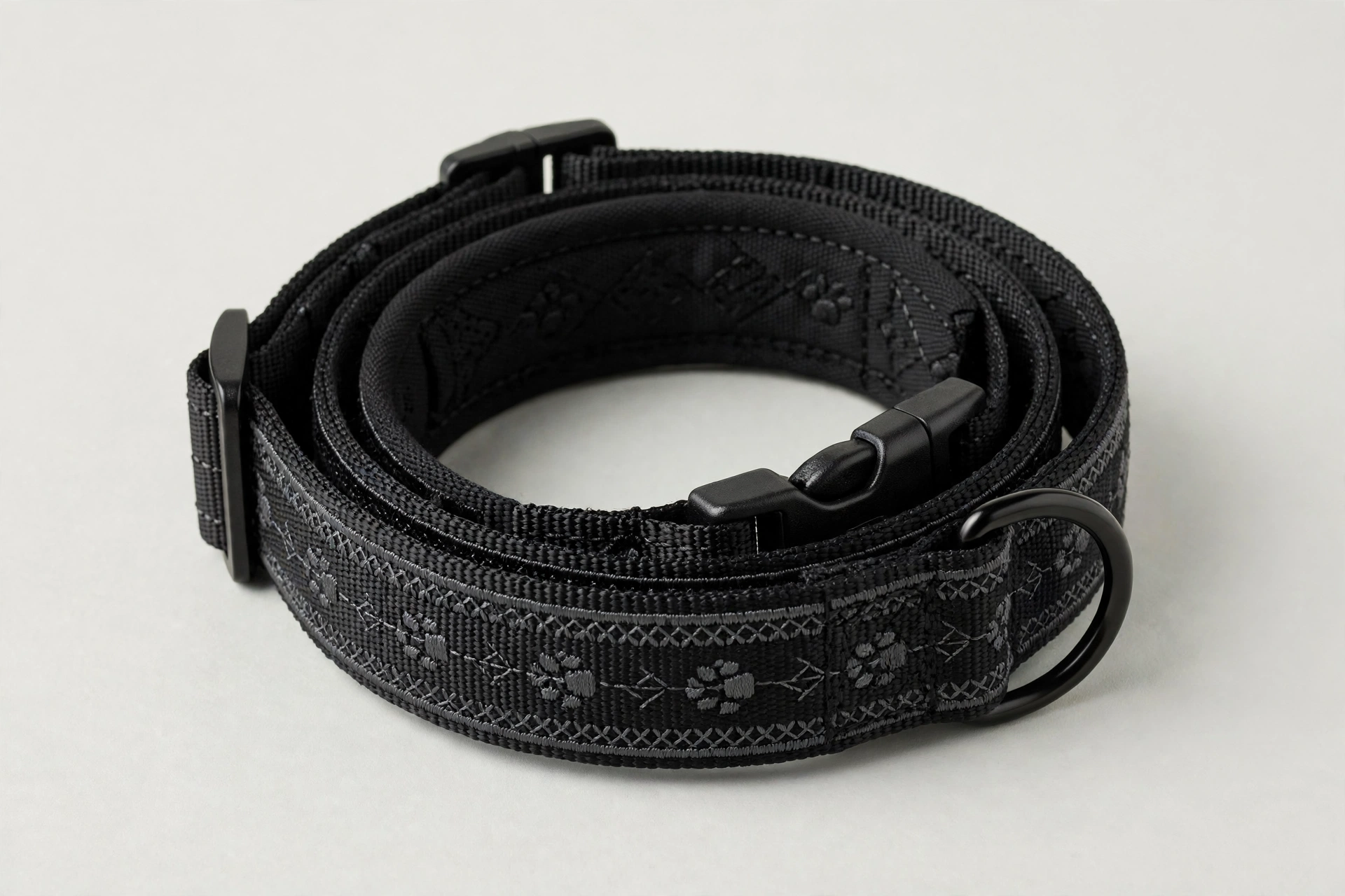 Embroidered service dog collar with stitched identification lettering, editorial product photo