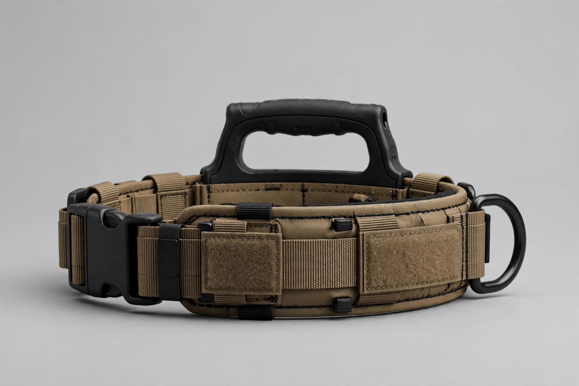 Tactical service dog collar with control handle and patch panels, editorial product photo